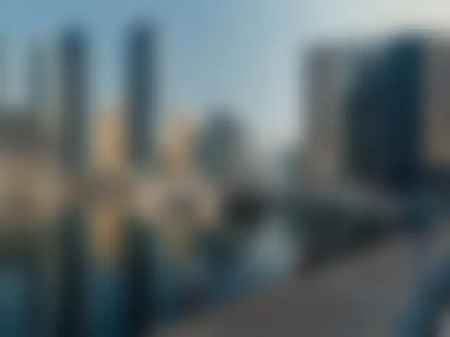 Dubai Marina towers, shown blurred