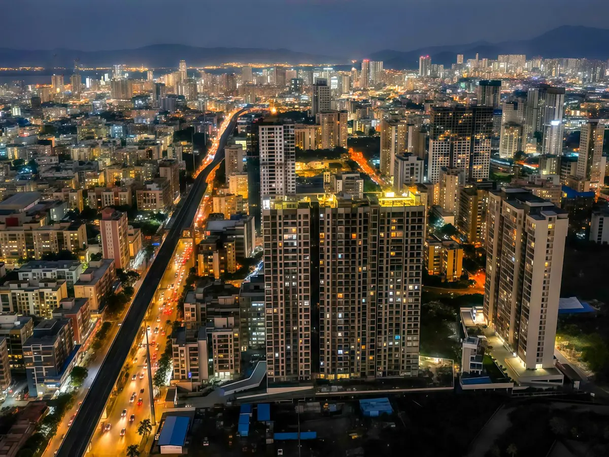 Mumbai at night with city lights and the sea